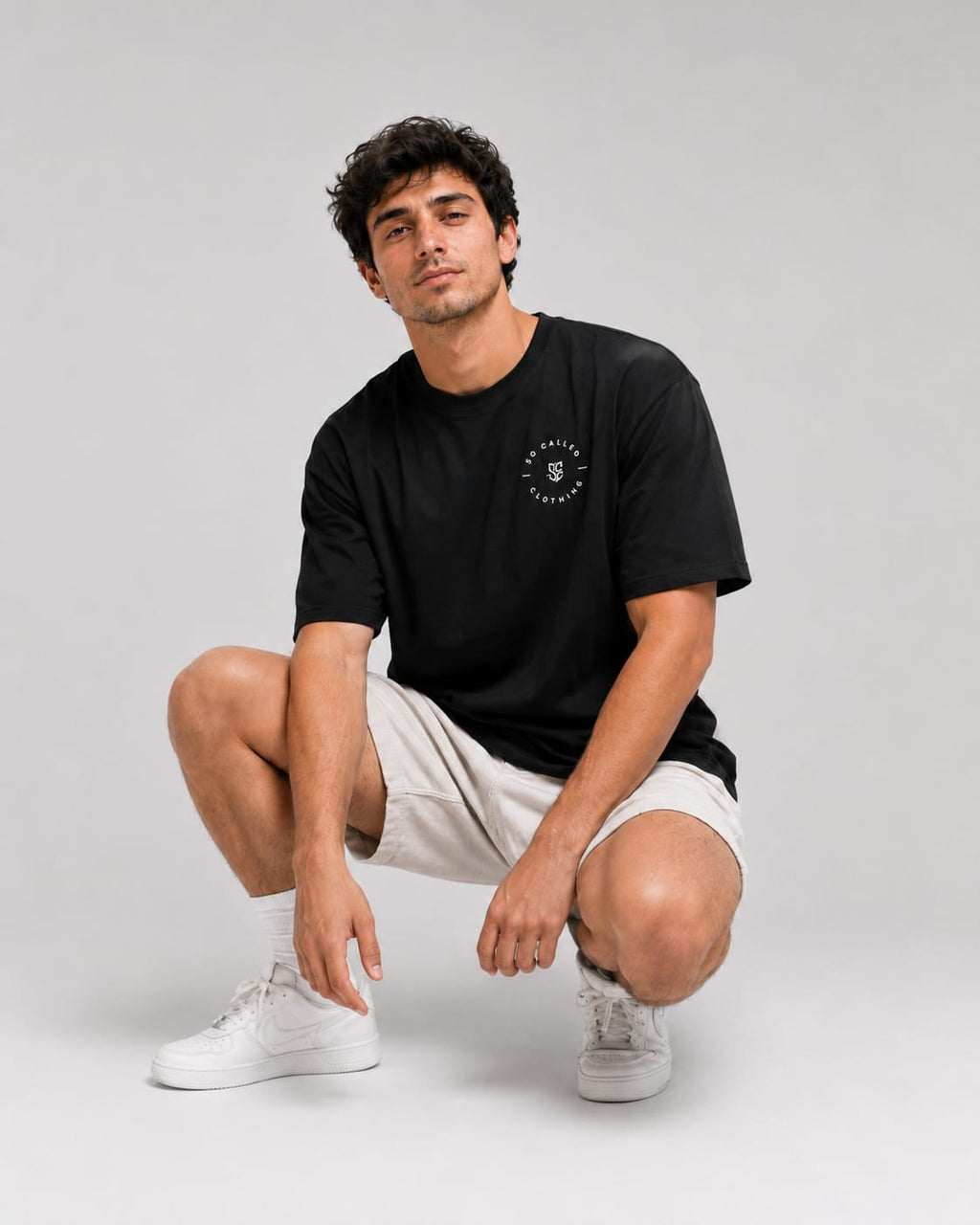 Color: Black | View: Model | Essential Logo Tee