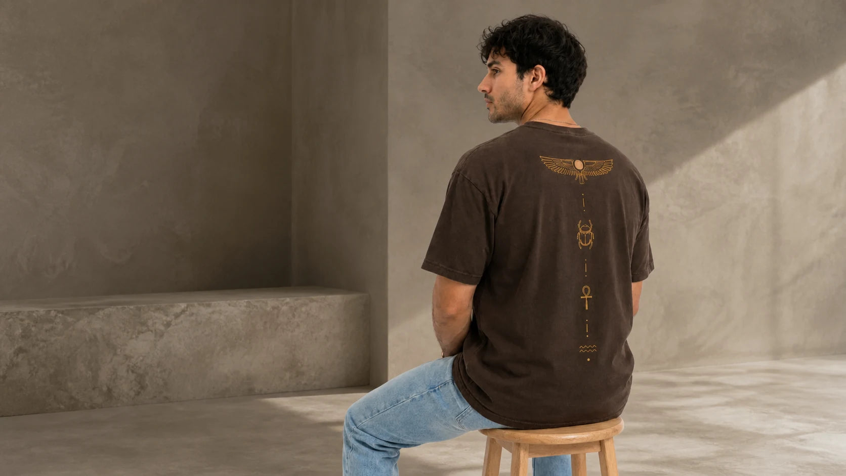 Model showing the earth-brown Symbol T-shirt back artwork